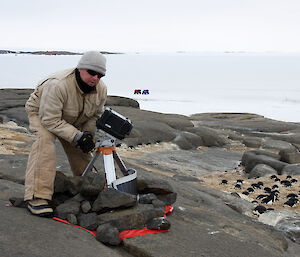 Installing a camera at a penguin colony on Welch Island near Mawson station (Photo: Peter Schuller)