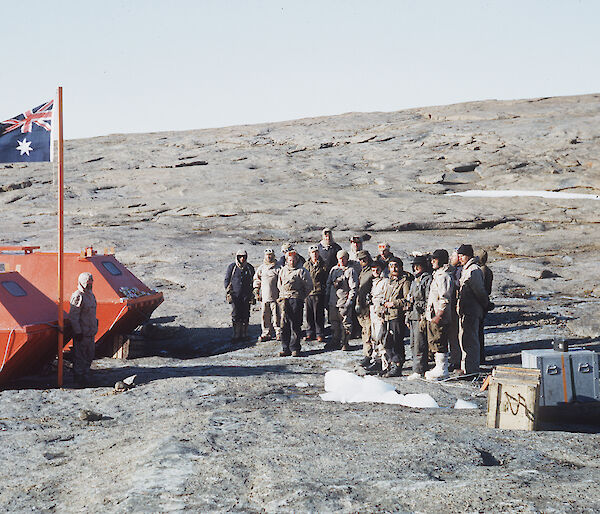 Raising the flag at the establishment of Mawson station