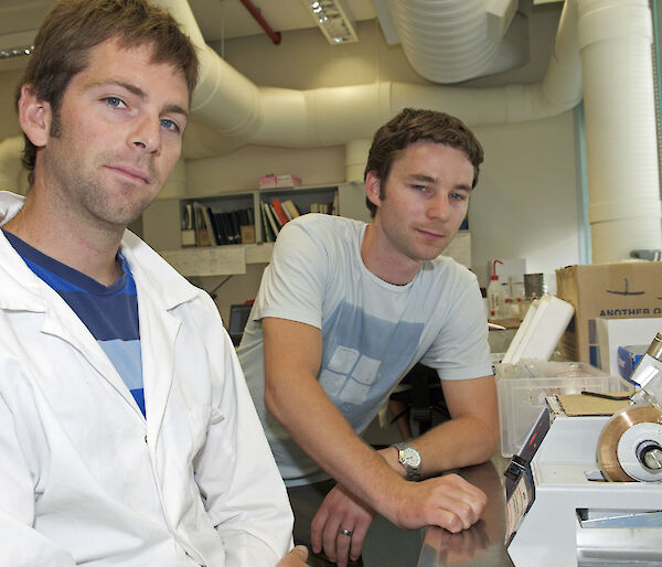 Jeremy Verdouw (left) and Joe Hutchins with the diamond-tipped saw used to slice thin otolith sections.