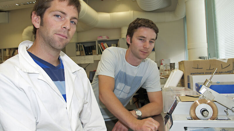 Jeremy Verdouw (left) and Joe Hutchins with the diamond-tipped saw used to slice thin otolith sections.