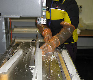 Meredith Nation cuts a ‘chemistry stick’ from the centre of the ice core.