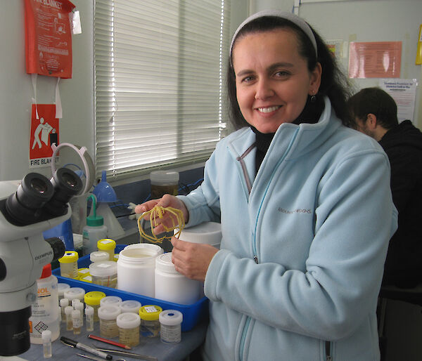 Dr Claudia Arango with a giant sea spider from Antarctica.