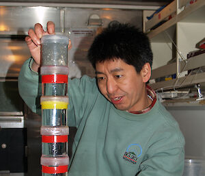 Dr So Kawaguchi with jars of krill collected from the Southern Ocean.
