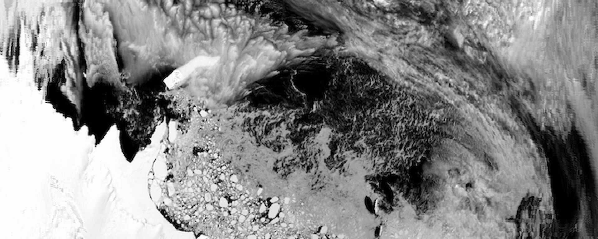 A raw MODIS image showing the Antarctic continent, lower-left corner, and the Southern Ocean. Heavy cloud cover is visible over much of the image.