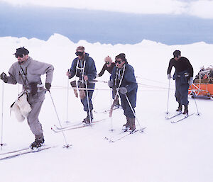 Men hauling a sled