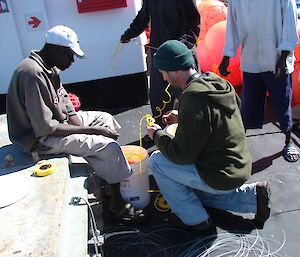 Fishermen working on line