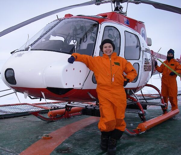 Natalia in front of helicopter