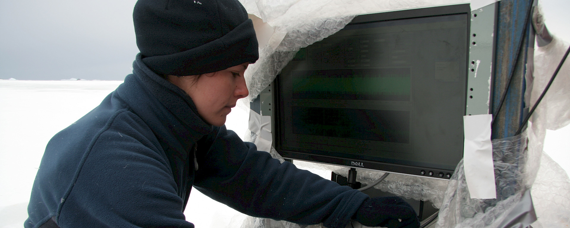 Natalia makes adjustments to the radar in Antarctica