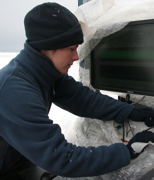 Natalia makes adjustments to the radar in Antarctica