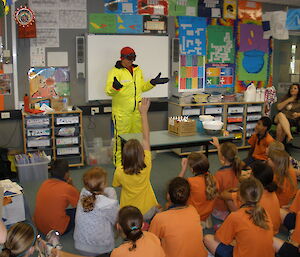 Barbara demonstrates Antarctic clothing to students in Darwin