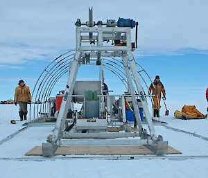 Scientists on the Amery Ice Shelf setting up tent and framework for hot water drill