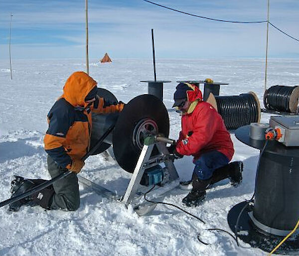 AMISOR hot water drilling program on Amery Ice Shelf — Scientists preparing hose winder for hot water drill