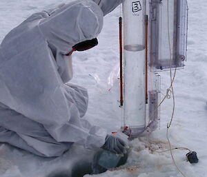 Casey expeditioner sampling seawater