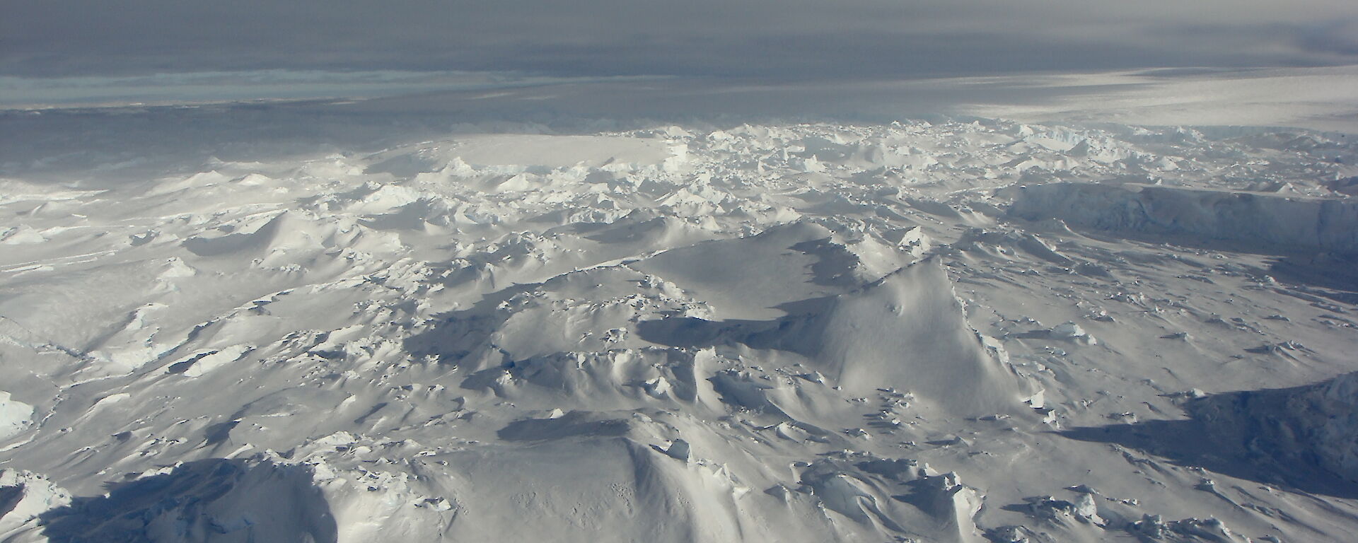 The Totten Glacier in East Antarctica reaches the Southern Ocean in a jumble of broken ice on the southeast side of Law Dome.