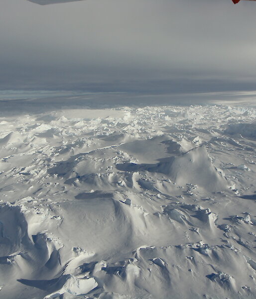 The Totten Glacier in East Antarctica reaches the Southern Ocean in a jumble of broken ice on the southeast side of Law Dome.
