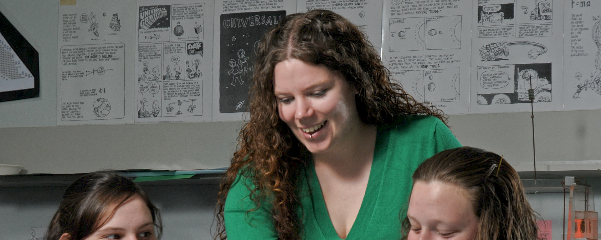Jane Dobson teaching a Physical Science class with students Jodie Bewley and Kiara-Lee Gough
