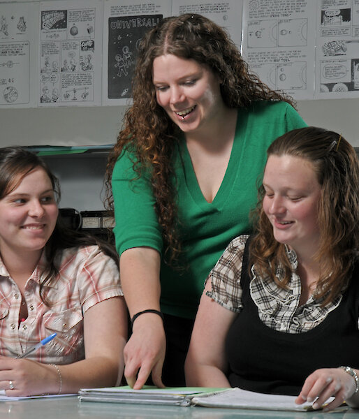 Jane Dobson teaching a Physical Science class with students Jodie Bewley and Kiara-Lee Gough