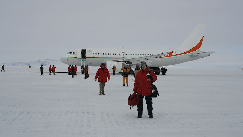 Antarctic Division personnel disembarking the A319 aircraft on the ice at McMurdo station