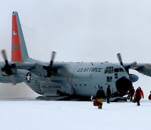 The first summer expeditioners disembark the Hercules at Casey station