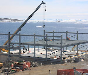 Crane constructing the steel framework of the living quarters at Davis station in April this year