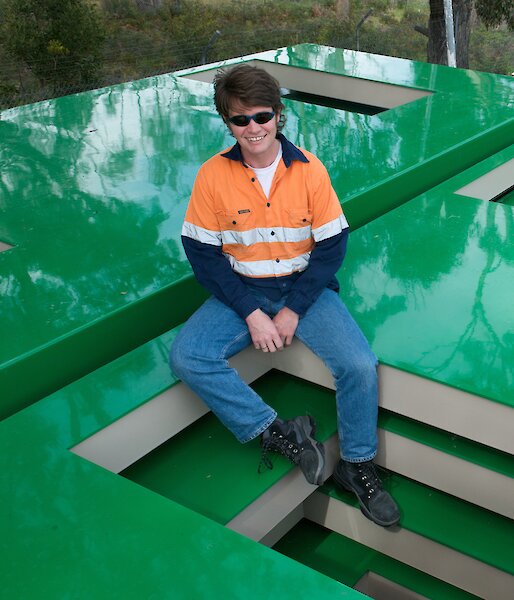 Project Engineer Mark Pekin sitting on some of the finished panels ready to be shipped to Antarctica