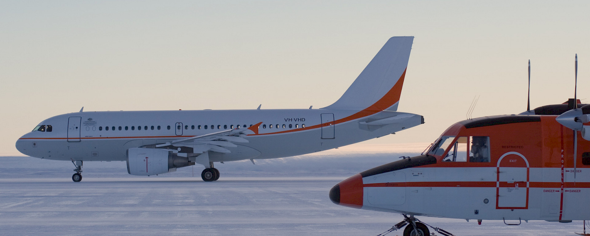 Airbus A319-400 and CASA 212–400 aircraft on the Wilkins Ice Runway in Antarctica