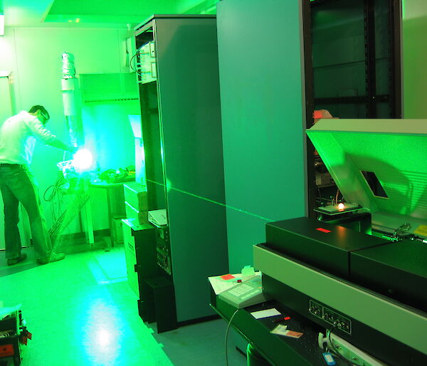 Shooting a green beam of light from the new laser for testing purposes at the Kingston laboratory
