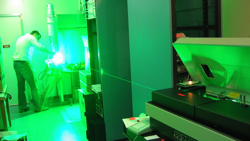 Shooting a green beam of light from the new laser for testing purposes at the Kingston laboratory