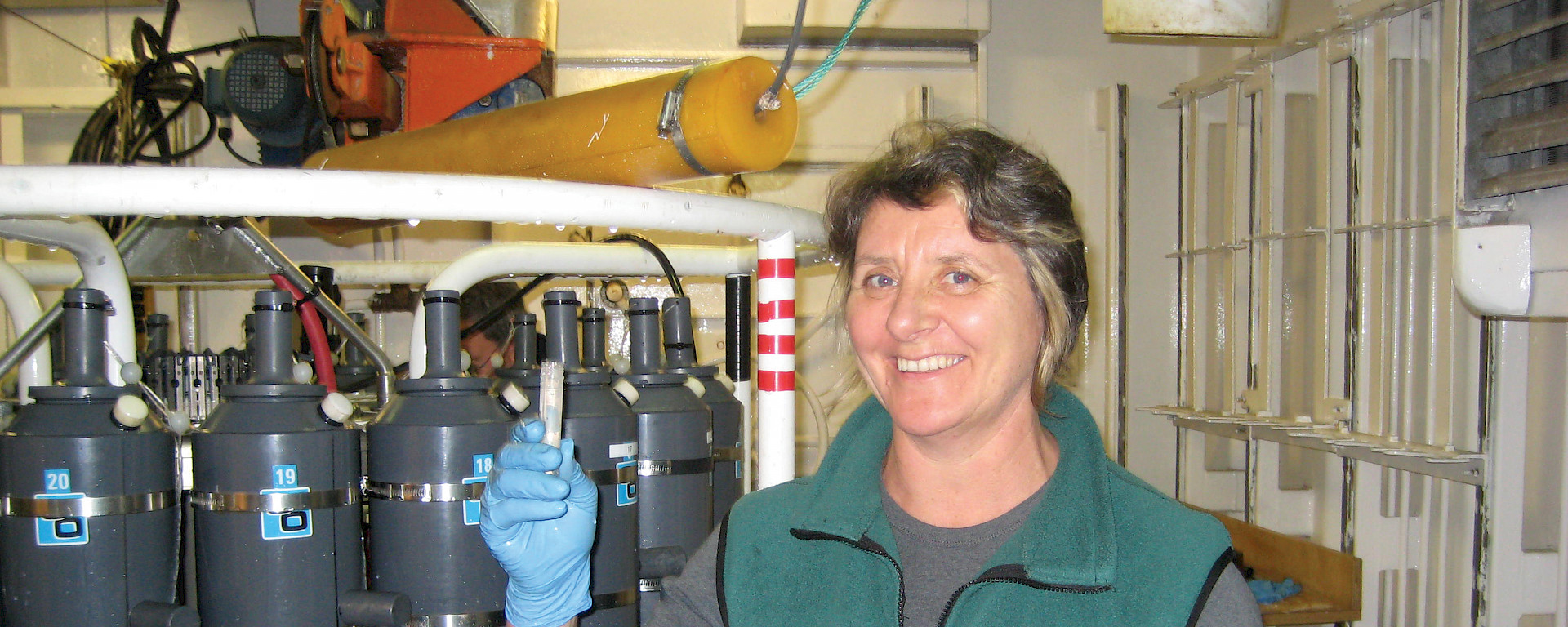 Margot Foster beside a Conductivity, Temperature, Depth recorder.