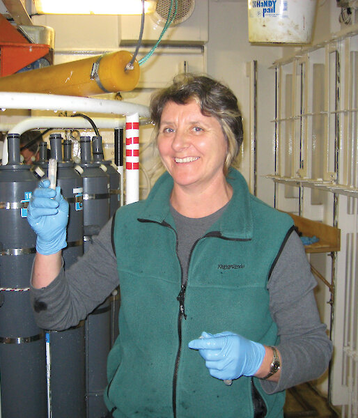 Margot Foster beside a Conductivity, Temperature, Depth recorder.