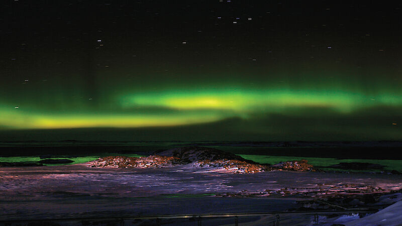 The same process that leads to the aurora, seen here over Newcomb Bay at Casey, also contributes to the global atmospheric electric circuit.