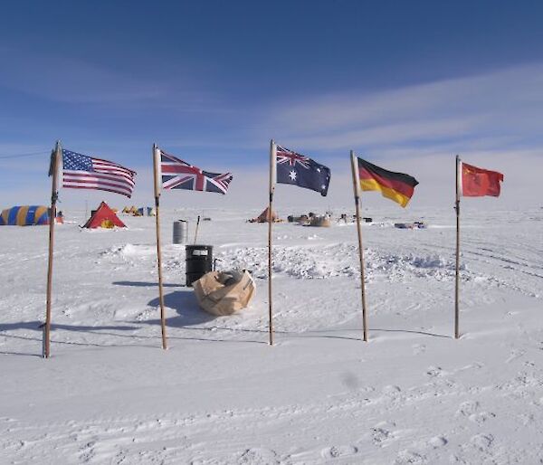 5 flag poles with flags from USA, England, Australia, Germany and China
