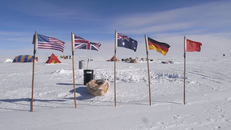 5 flag poles with flags from USA, England, Australia, Germany and China