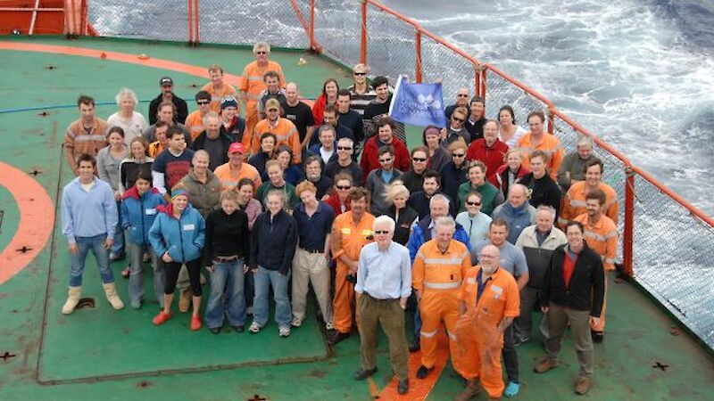 Group of expeditioners on the heli deck of the Aurora Australis.