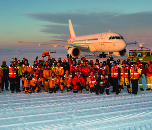 Passengers, crew, expeditioners and ground support staff cheer the first successful AAD Airlink passenger flight