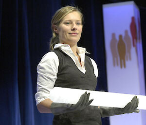 Dr Tessa Vance presenting the ice core from Antarctica