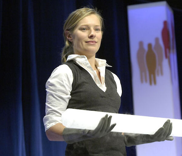 Dr Tessa Vance presenting the ice core from Antarctica