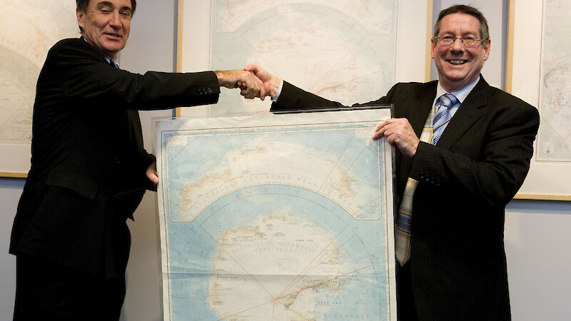AAD Director Dr Tony Press (right) presents the map to National Archives Director-General Ross Gibbs