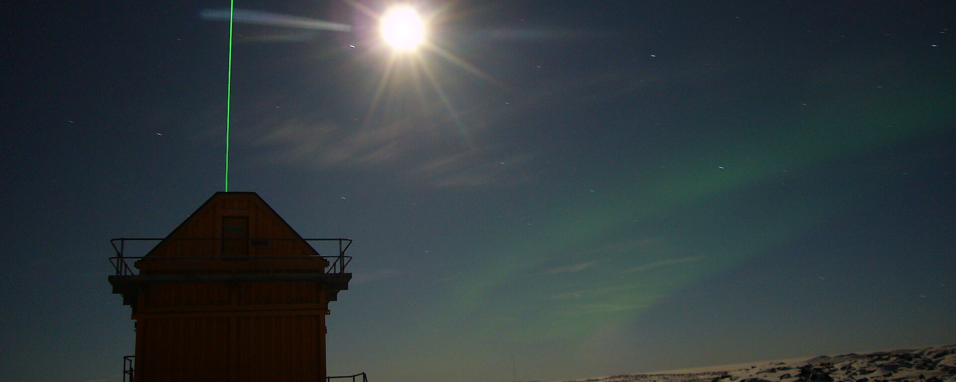 The green beam of the Davis lidar, and the sun in the sky