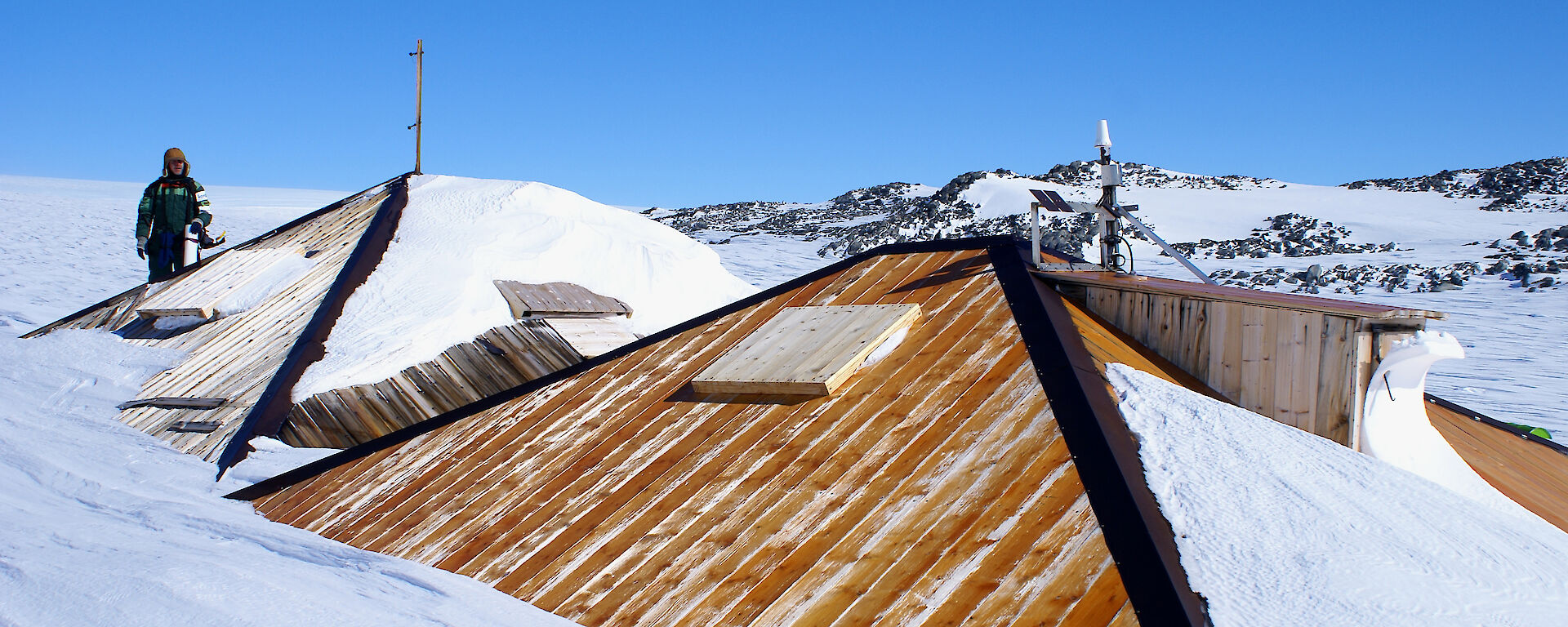 After — overcladding of the main hut roof in progress