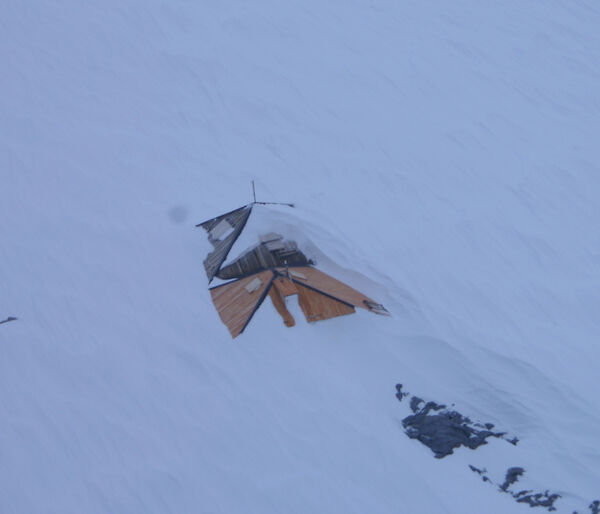 Before — the main hut roof snowed in