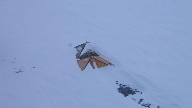 Before — the main hut roof snowed in