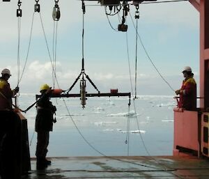 Kelvin, Brian and Luke demonstrate the fine art of trawling in sea ice