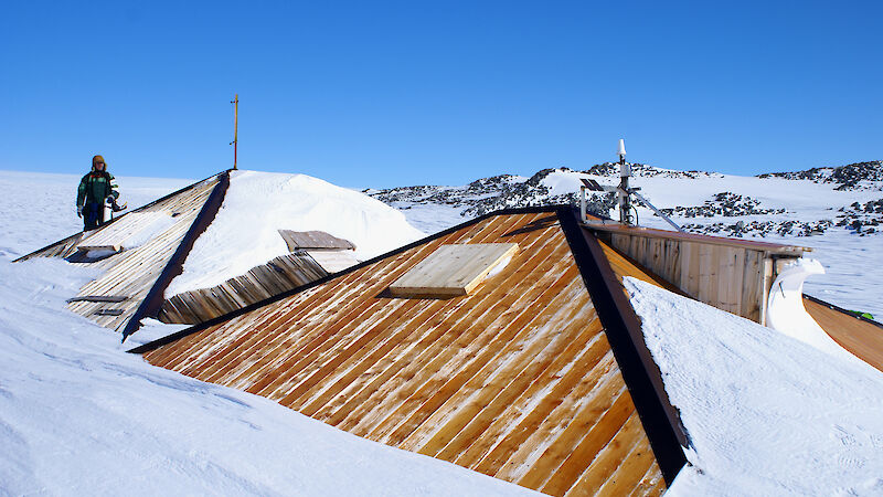 After restoration work, overcladding of the main hut roof in progress