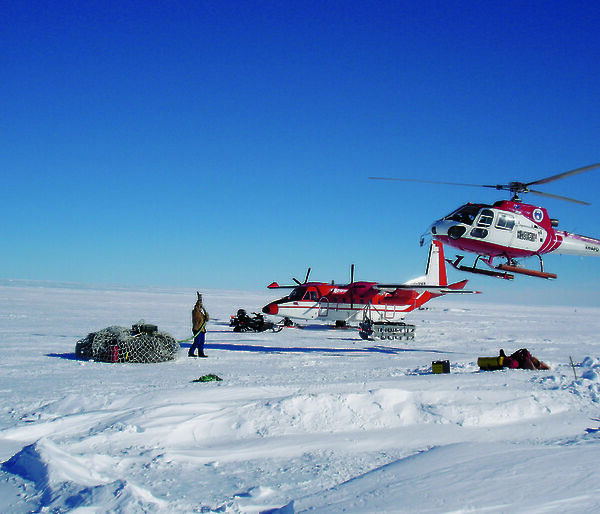 Sharon Labudda prepares to hook up a load of cargo to the helicopter.