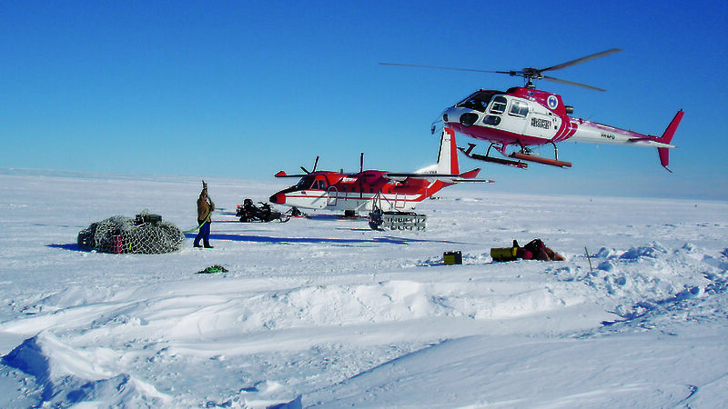 Sharon Labudda prepares to hook up a load of cargo to the helicopter.