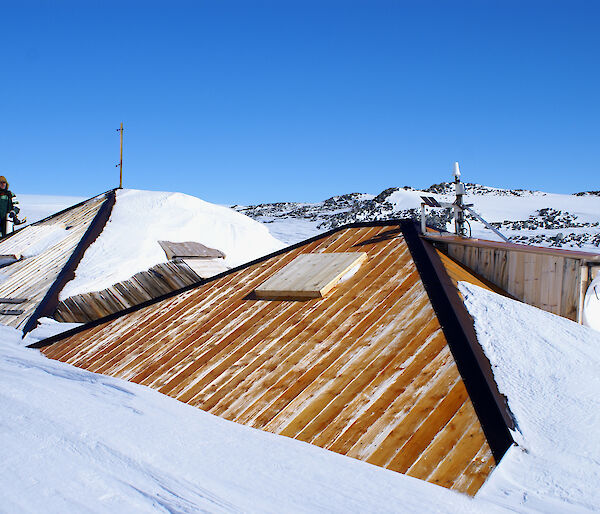 After restoration, overcladding of the main hut roof in progress