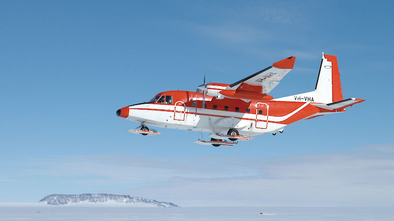 Ski-equipped CASA 212-400 aircraft landing.