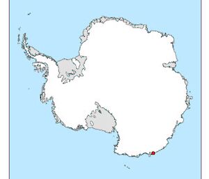 Map of Antarctica showing ice shelves (grey) and Commonwealth Bay (red dot)