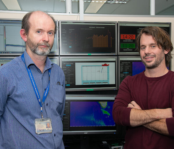 Lloyd Symons (left) and Michael Santarossa in front of computer screens set up to mimic the Aurora Australis science control room and deliver ‘data in real time’ (DiRT).